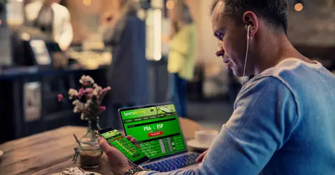 man-using-sports-betting-services